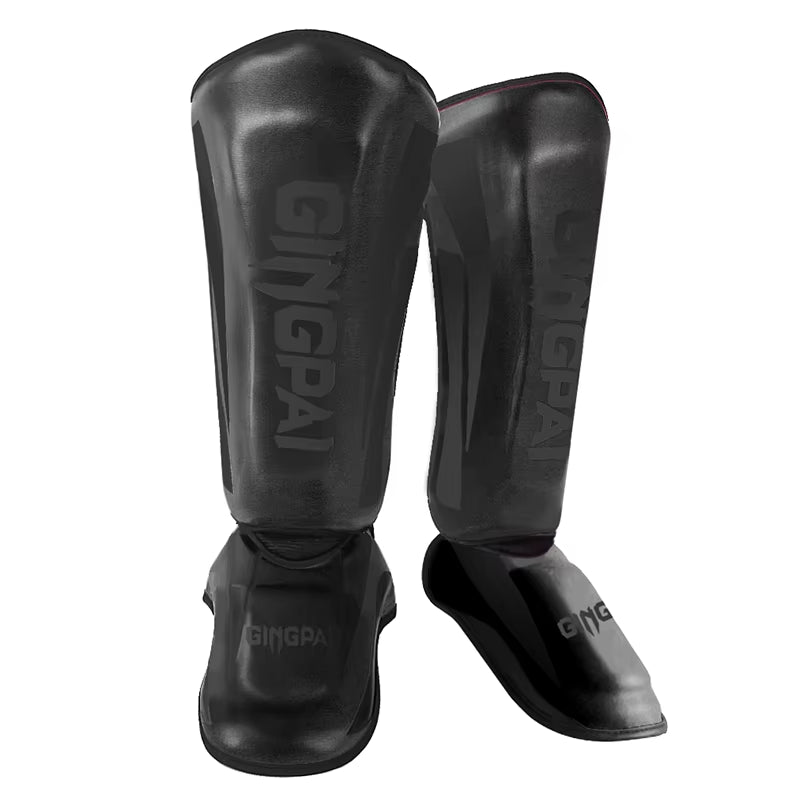 kickboxing shin guard pads in black color for martial arts and Muay Thai training.