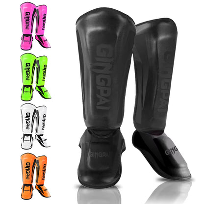 kickboxing shin guard pads available in pink, green, orange, white, and black for martial arts protection.