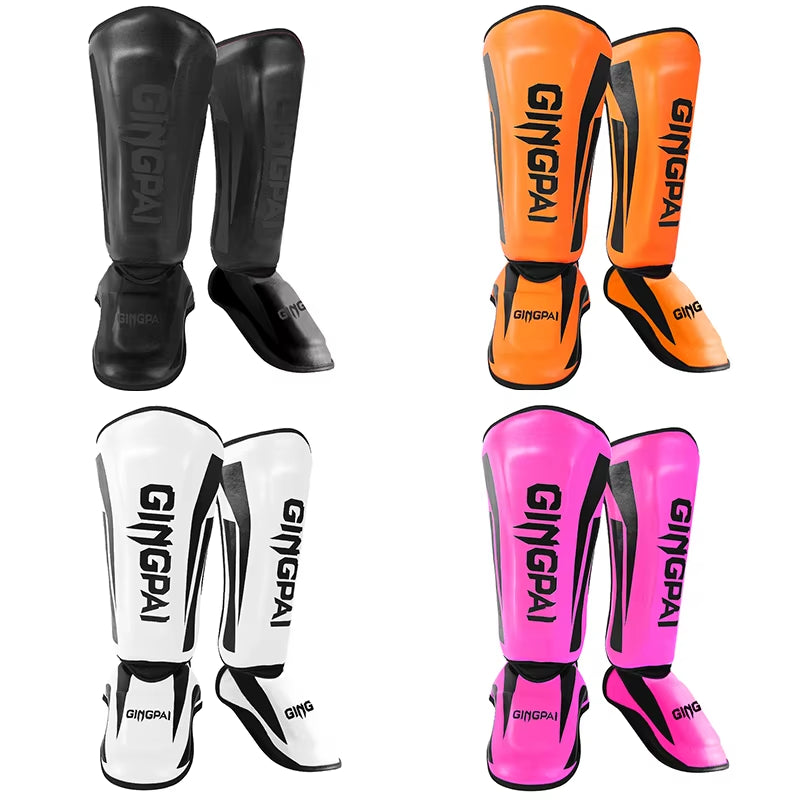 kickboxing shin guard pads in various colors: black, orange, white, pink for martial arts training.